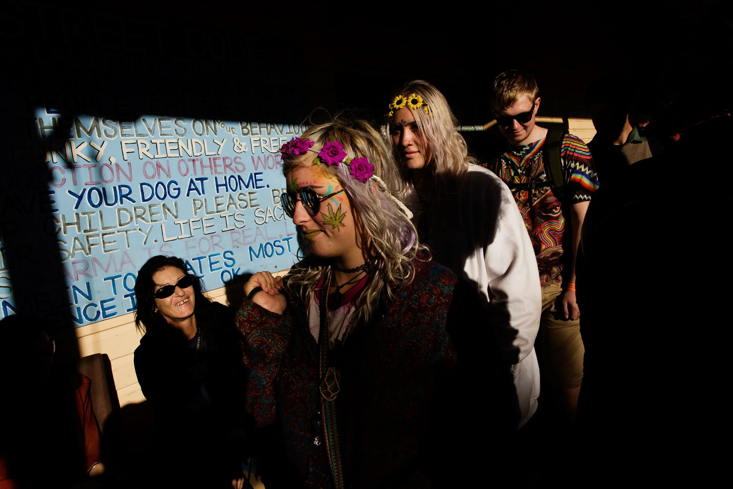  Young marijuana enthusiasts make their way through crowds on Cullen Street, Nimbin NSW, Australia. Tourism plays a vital role in stimulating the economy of the town, with thousands attending Mardigrass annually, and bus loads of tourists everyday. 