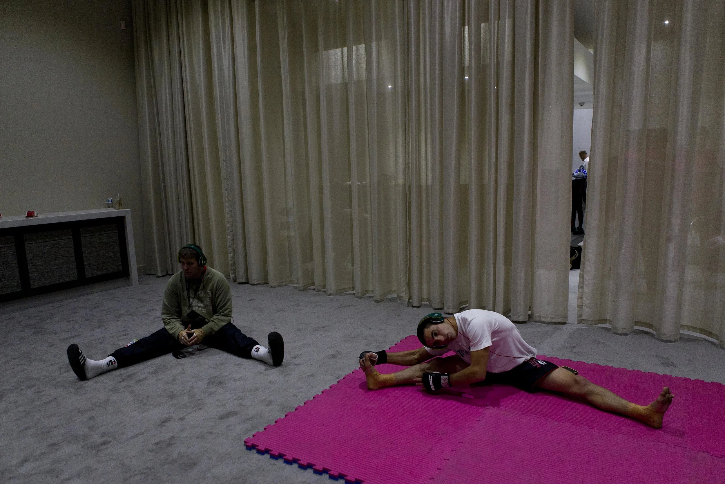  Fighters Daniel Kelly (L) and Ivo Dos-Santos stretching before fight at the Australian Fighting Championship, Melbourne Pavilion, Victoria. 