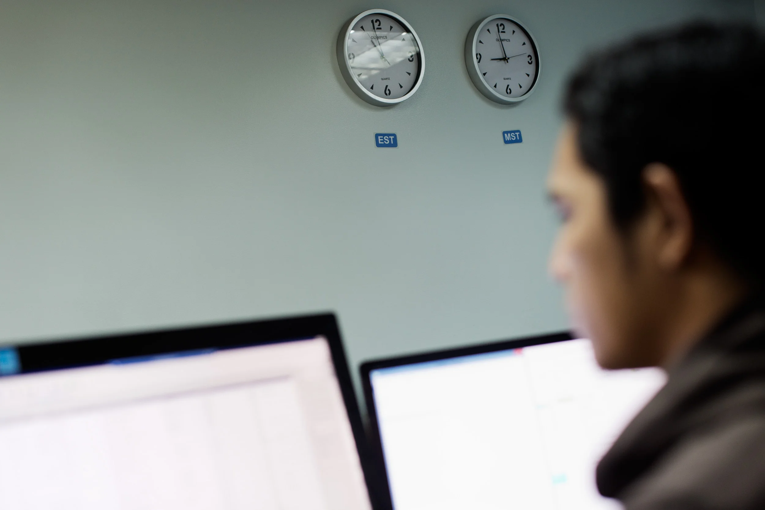  Clocks on the wall remind employees of the time they are working on across the other side of the world. A worker at Staff Virtual, an outsourcing company in Makati City, Philippines, trawls through information and records late at night for customers