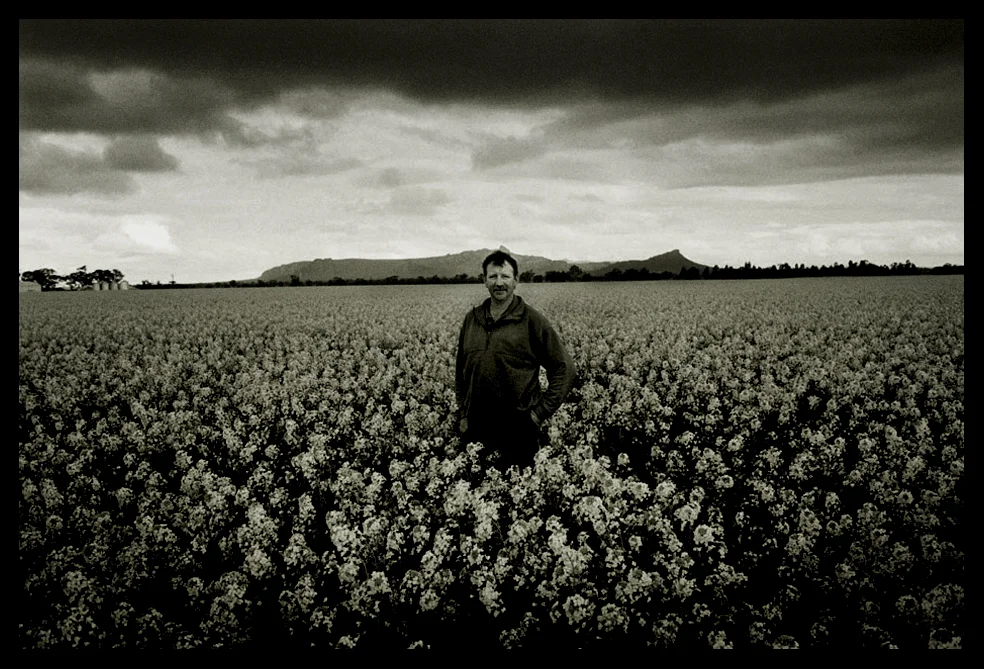 Canola farmer Ken Schilling stands on his property on the Wimmera Highway, where Mount Zero can be seen just outside of Horsham. Horsham, Victoria 2007