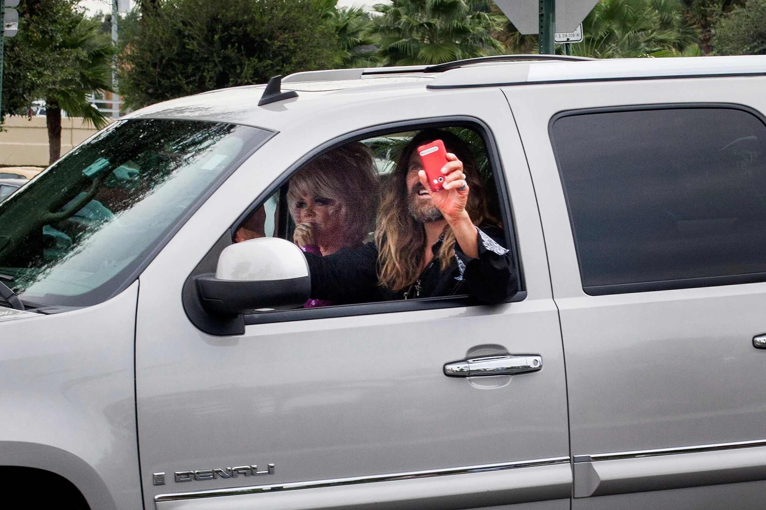 Jesus takes a photo of the photographer, with his phone upside down, and threatens prosecution if the story is published.