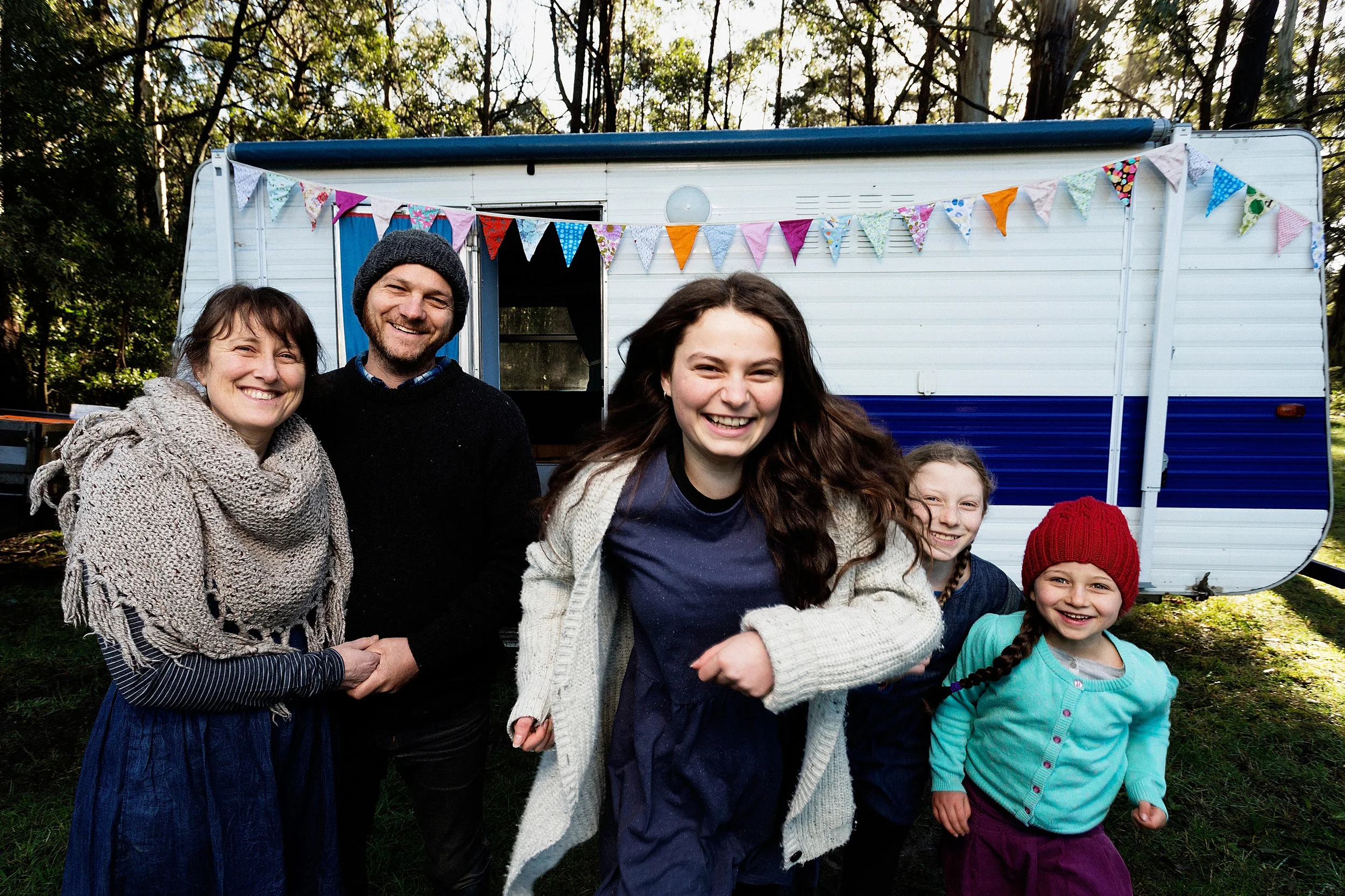  Kate Ulman poses for a photo with her husband Brendon Ulman and daughters (L-R)&nbsp;Indigo 13, Jarrah 10, and Pepper 6 with their renovated caravan on their Muskvale. Photograph for The Sunday Age. 