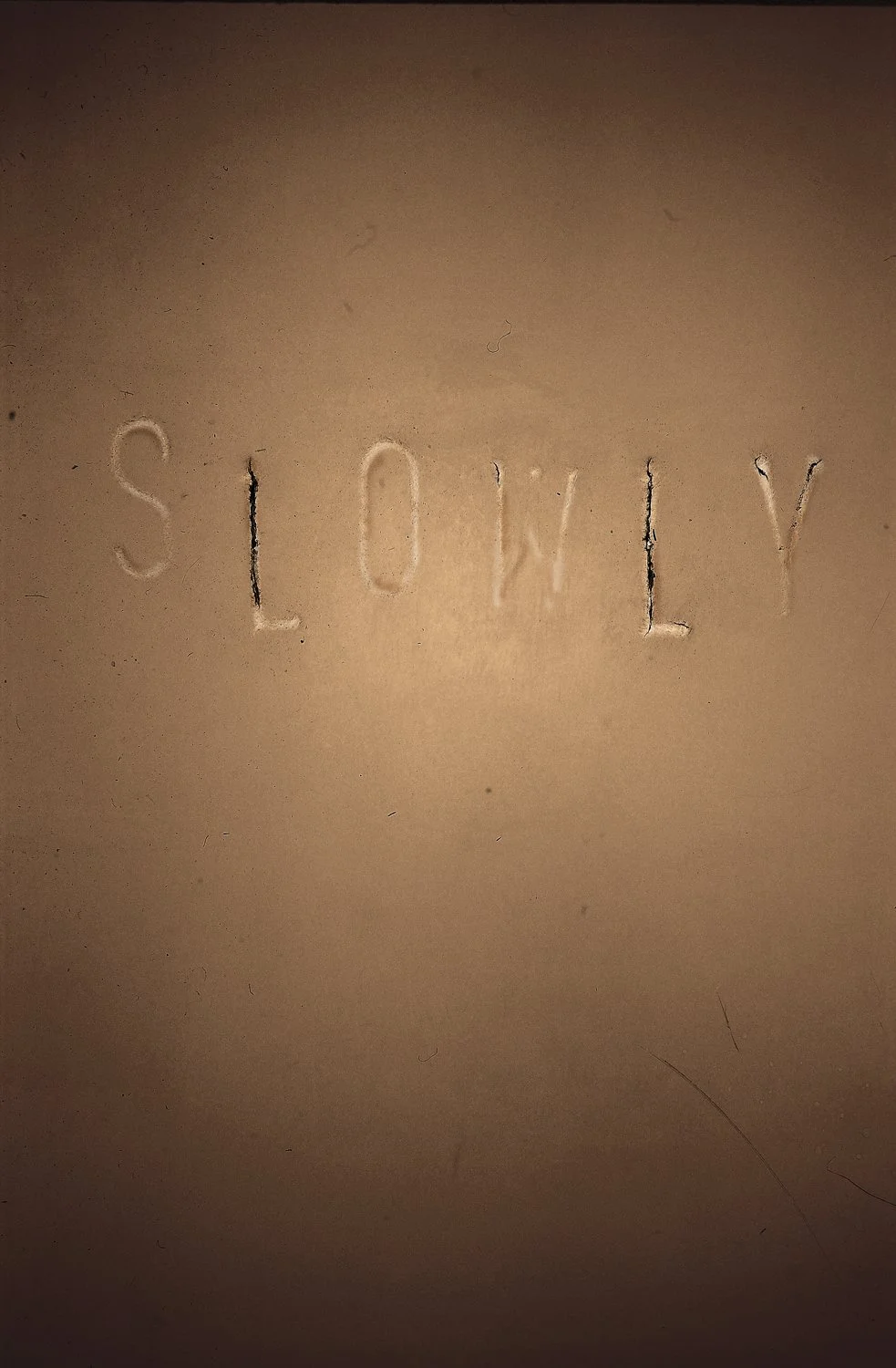 SLOWLY