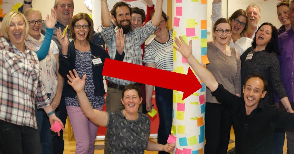 Follow the big red arrow and you'll find Sam’s smiling face at the end of it!
