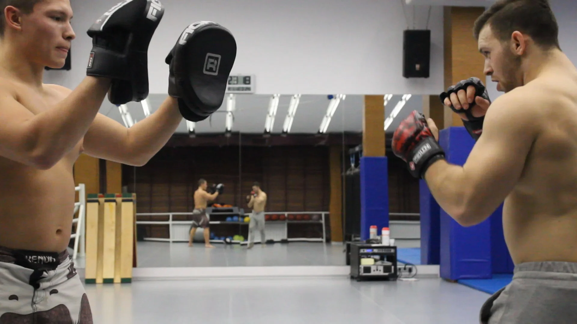 muscle fighting with two big guys