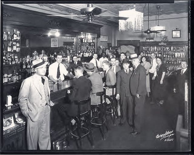 🍻 Say hello to the Olympic Bar circa 1936. Located downtown on the corner of Tampa and Cass (the Element today) it was quite the hot spot in its day. Why was it so popular? Turns out that two Italian brothers were running an illegal gambling operati