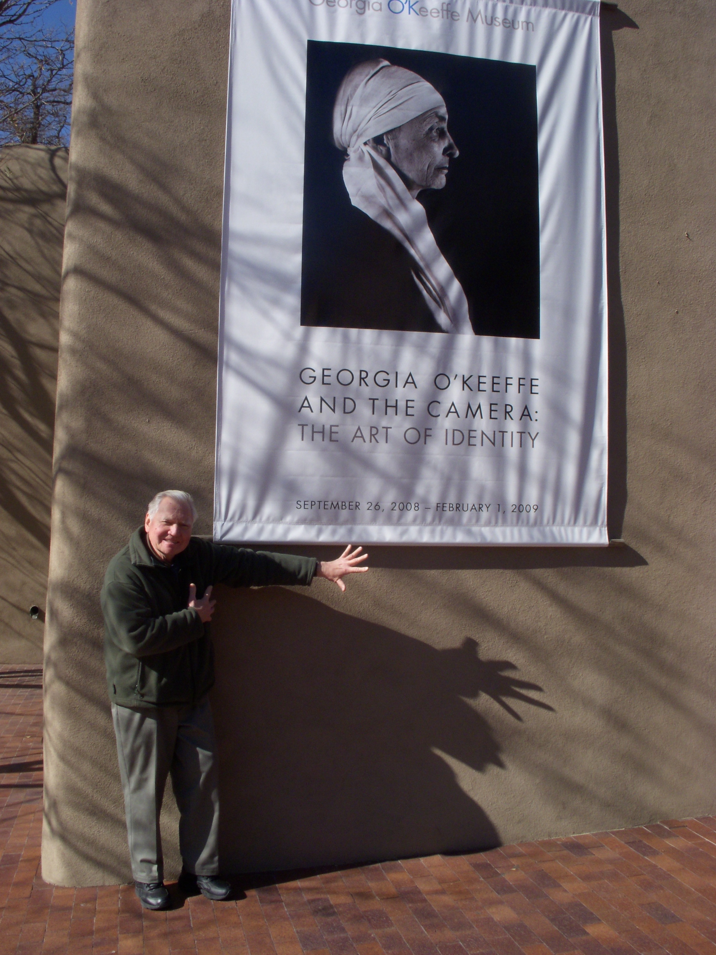   JU mimcs the dramatic poses and shadows he found in the photos of Georgia O'Keefe outside the Georgia O'Keefe Museum, Santa Fe, New Mexico, November 19, 2008  