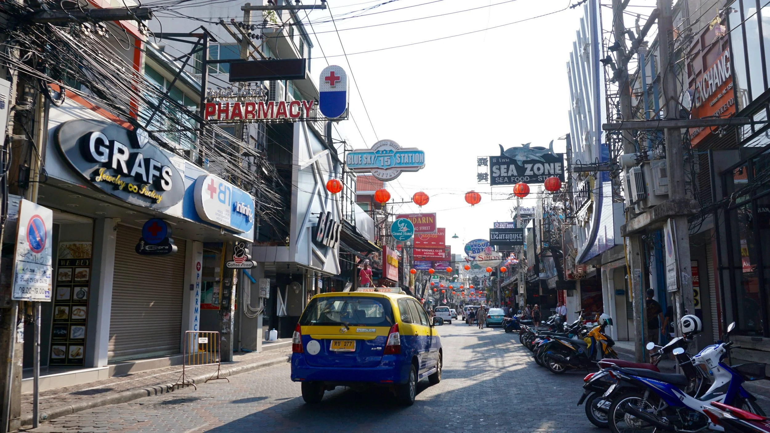 Walking Street in downtown Pattaya during the day.