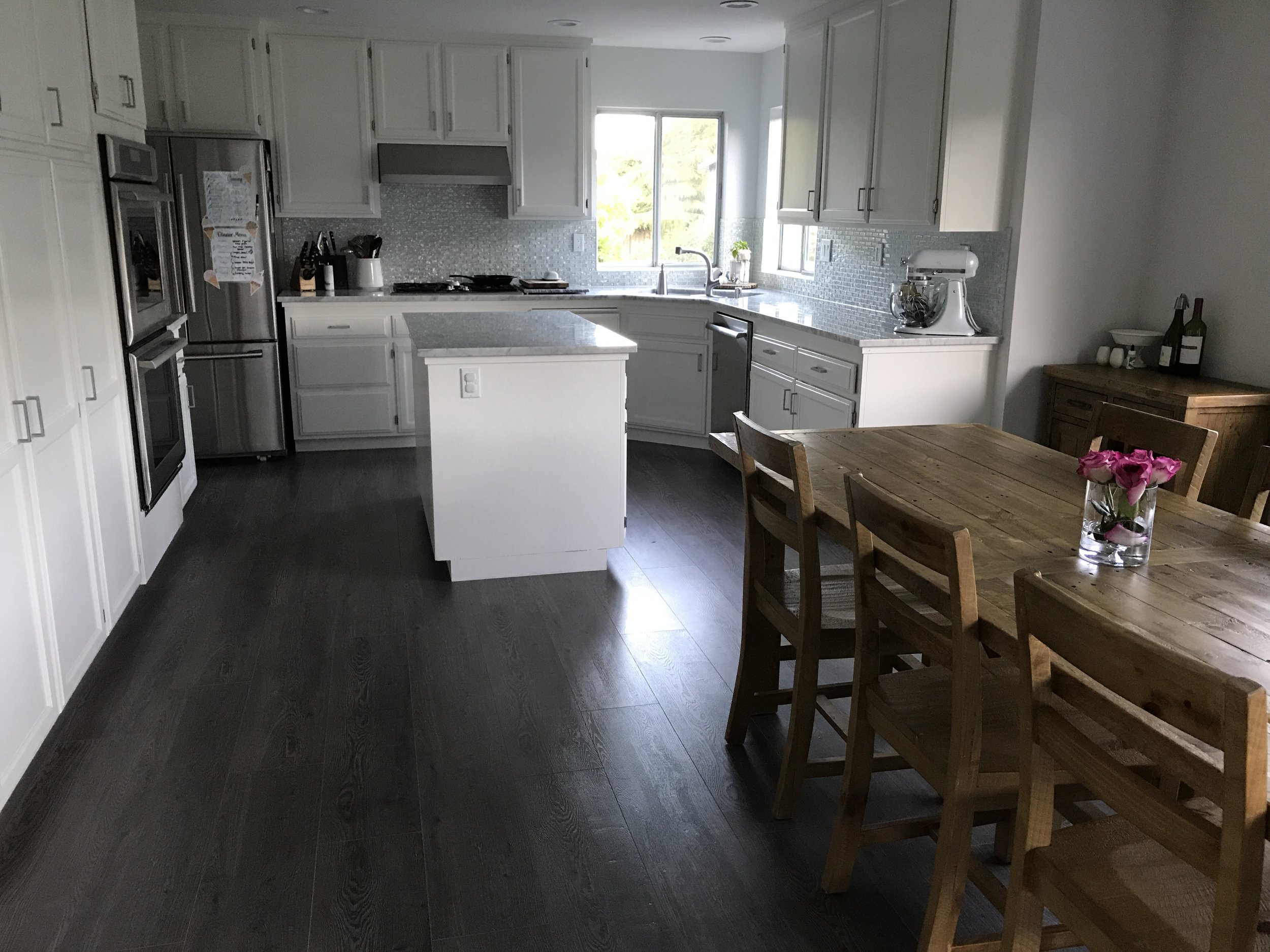 One of my favorite things to share on Instagram and Facebook is my #cleankitchenatnight posts! Couldn't resist sharing this alternate view on my blog! (PS check out the beautiful flower arrangemnt my Husband did!)