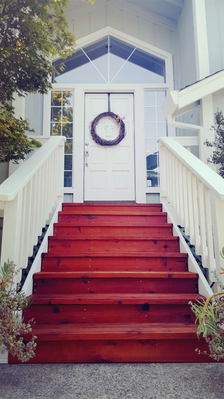 How beautiful are our new front steps! When my parent's were visiting, my dad and Husband spent a huge amount of time and energy making the steps. Over our vacation my Husband got the staining done and we are PUMPED for the final look!