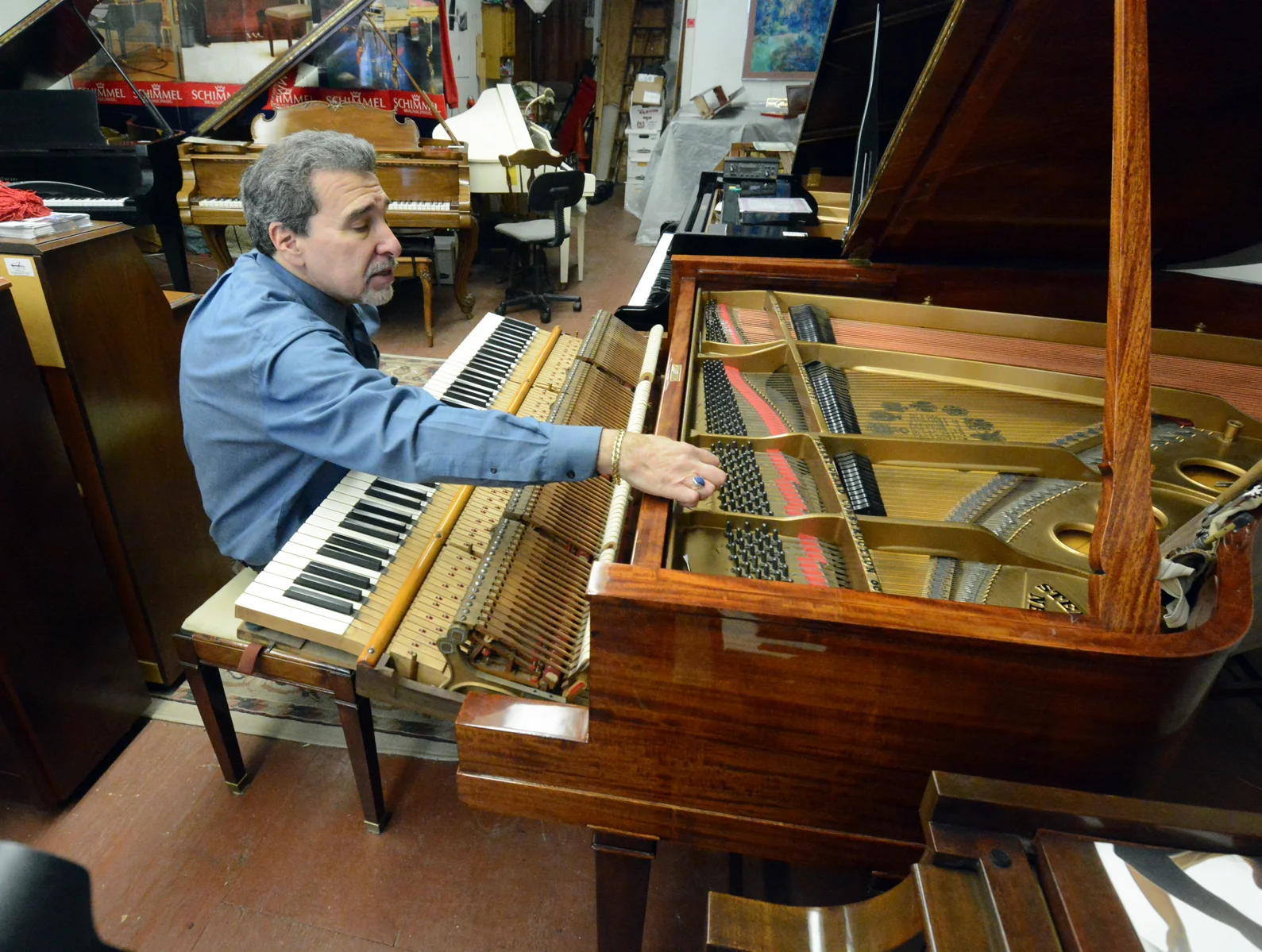 Evan Tublitz checking Regulation and Voicing on a Steinway Grand