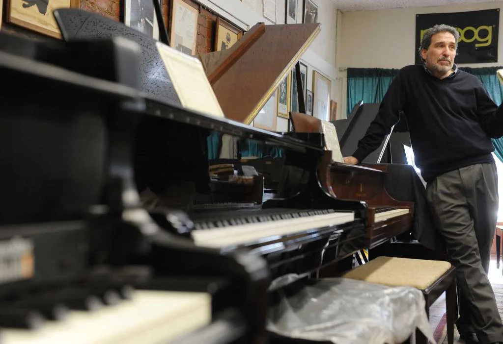 Evan Tublitz, owner of Used Piano Center, talks about his work at his shop on Park Ave. on Tuesday, March 26, 2013 in Mechanicville, NY. (Paul Buckowski / Times Union)