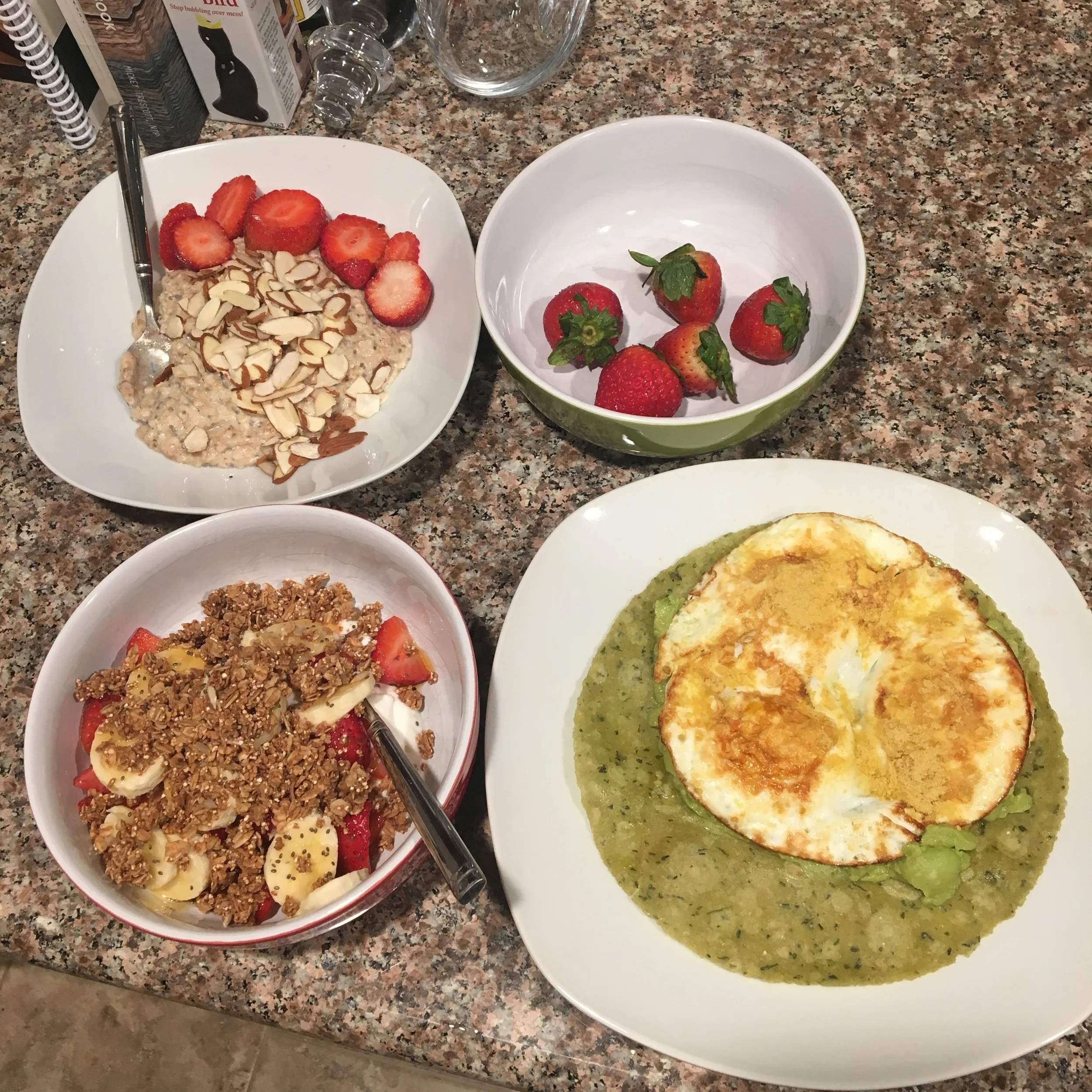 We made breakfast at home to save money and fuel up for an active day ahead. We made protein oats (top left), a greek yogurt parfait (bottom left) and fried eggs on a spinach tortilla with a side of strawberries. 