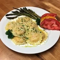 Lobster Ravioli with house-made Alfredo and a glass of wine? A hole in one!