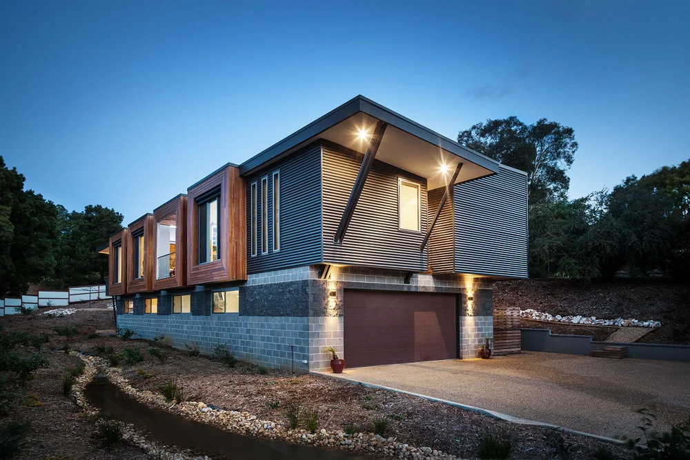 This homes garage enterance is located partially underground