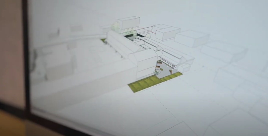 homeowners reviewing design plans