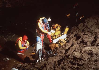  Pat Wiedeman (left), Bob Jefferys, and John Zumrick kit up at Sump 3. This was the first extensive use of composite tanks for cave diving (the dive at the San Agustin Sump in April 1981 was the only previous effort to use this technology). The team 