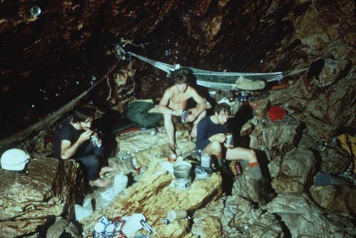  Spartan Outpost: Left to Right: Bob Jefferys, Rob Parker, and Noel Sloan work on a humble meal of freeze dried food at Camp 2, 4.2 kilometers from the entrance and beyond six sumps comprising a kilometer of underwater travel. Camp 2 was occupied for