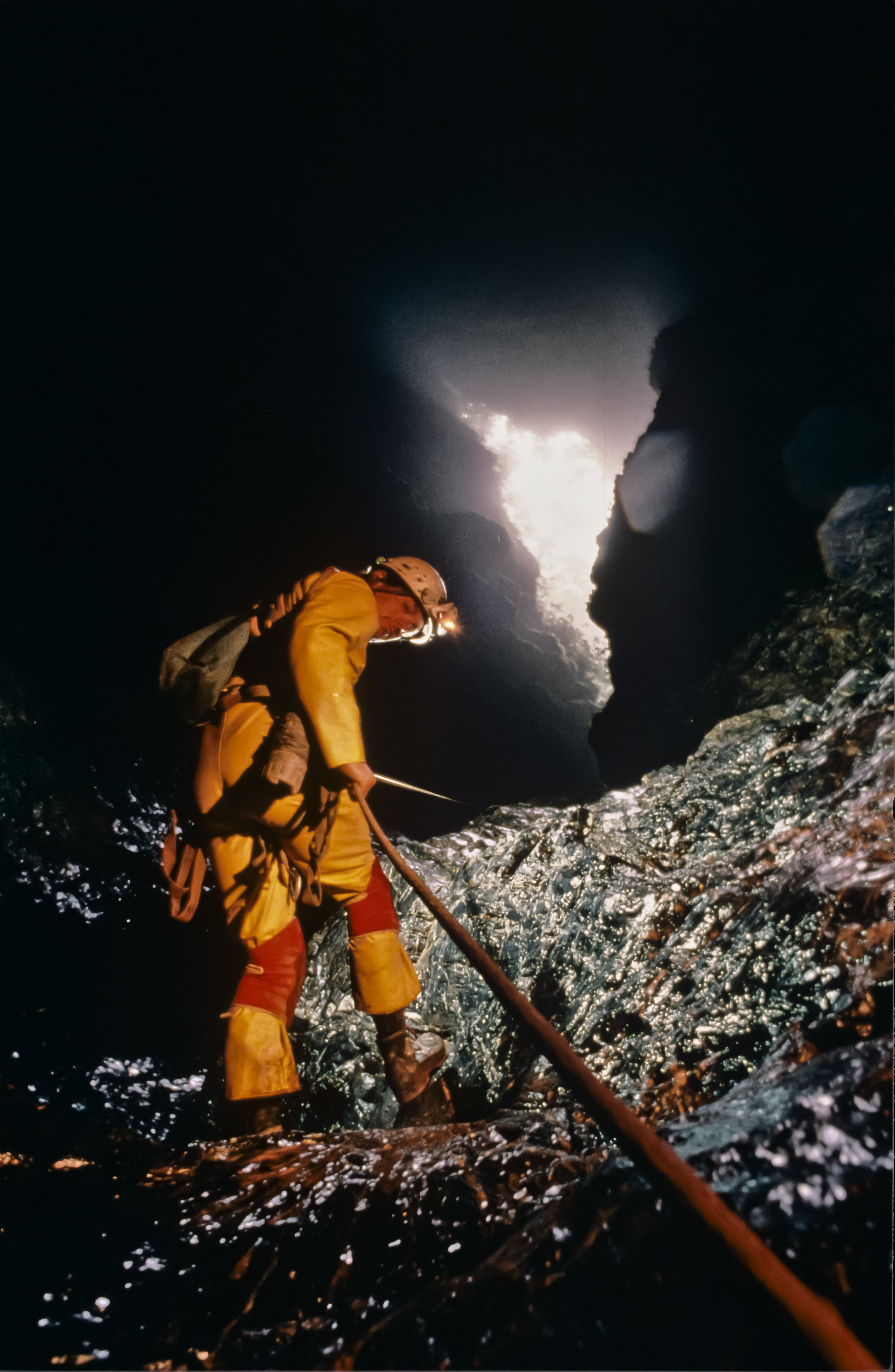  Jim Brown completes the descent of the "slip and slide" pitch. At 120m vertically below the surface the last bit of daylight is visible before beginning the long trip down. Photo by U. S. Deep Caving Team/Wes Skiles. 