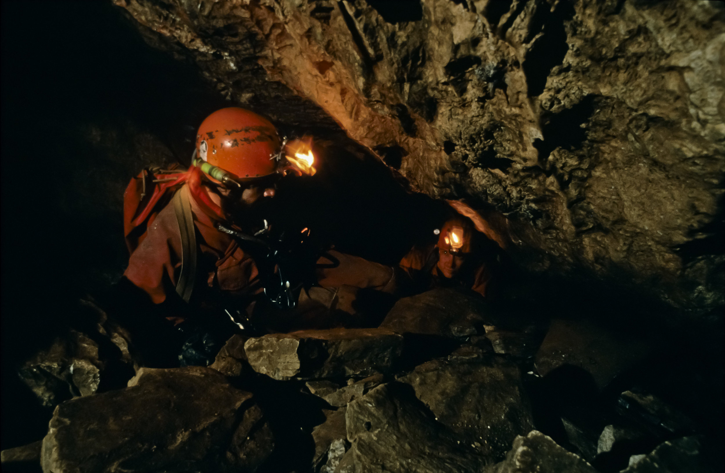  Shortly beyond the entrance shaft a new passage - the Fool's Day Extension, discovered by Mark Minton and Bill Steele in 1988 - leads to a series of constrictions. Photo by U. S. Deep Caving Team/Wes Skiles. 