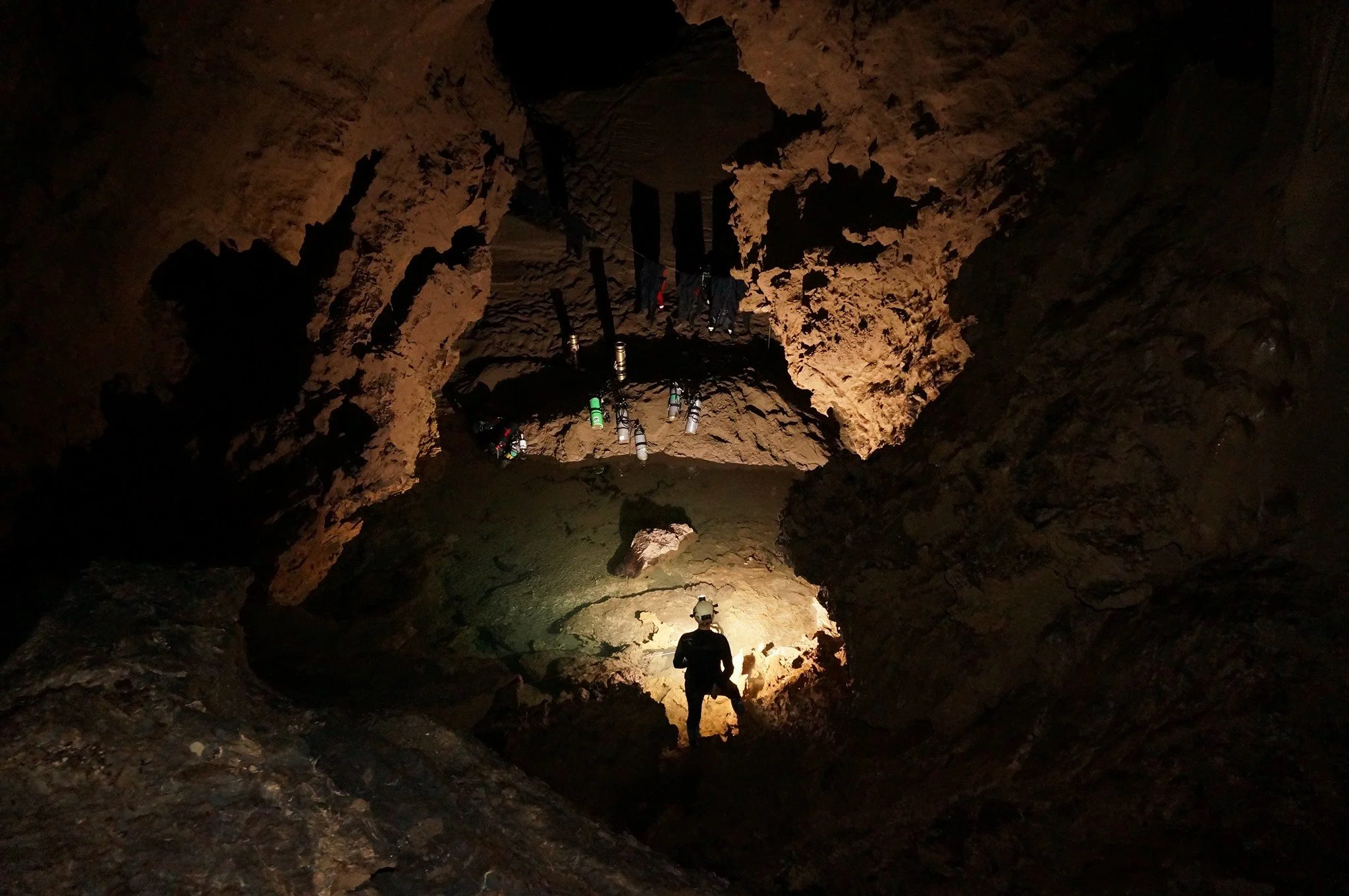 A photo of Camp 1 in the Huautla Resurgence taken from the higher upper levels which lead towards the two sump pools found by Jason Mallinson in 2001. Sump 2 emerges from the left of the sump pool. Photo by Chris Jewell.