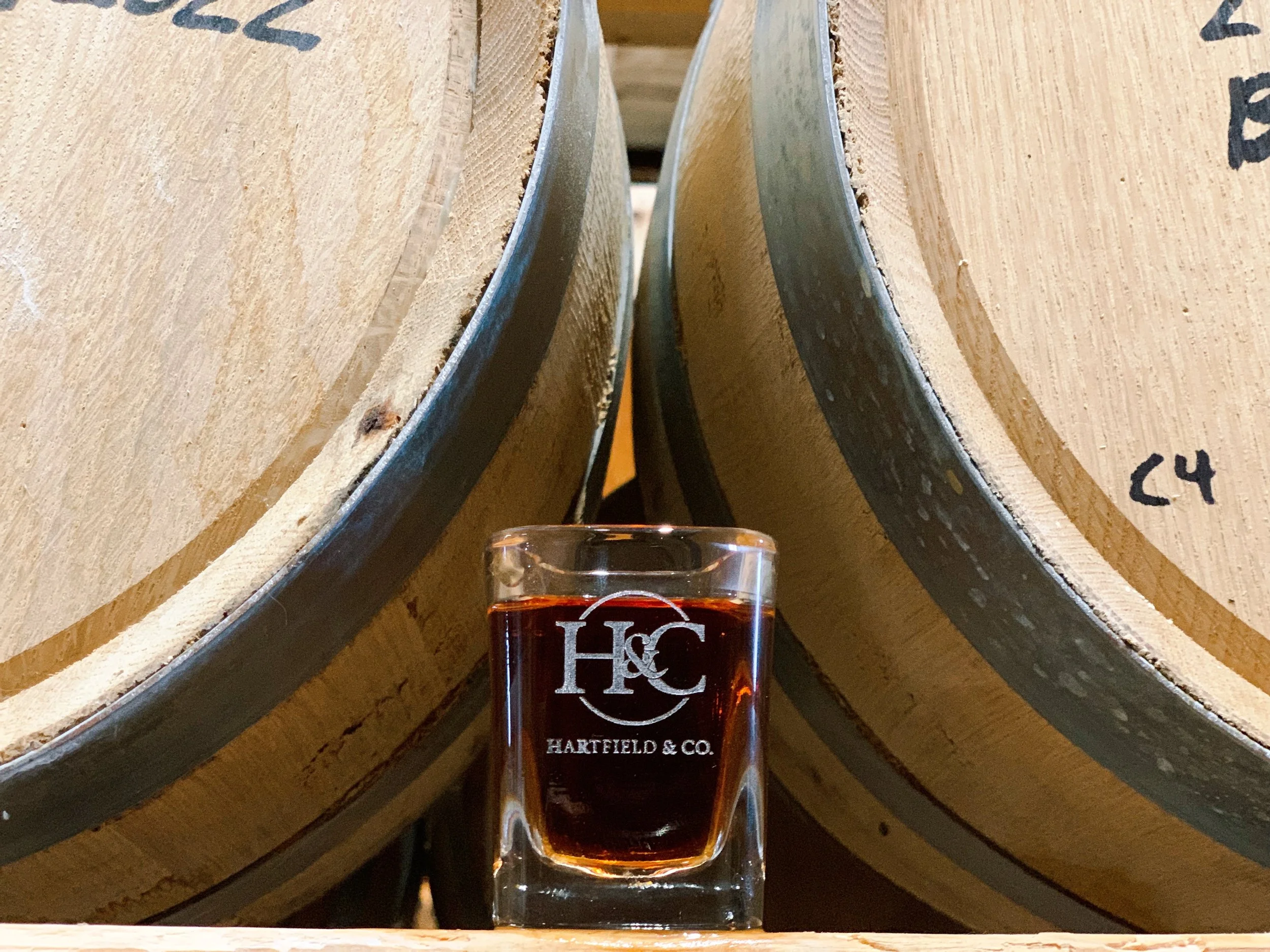 Hartfield & Co Distillery Shot Glass with Barrels - copyright Hartfield & Co. Distillery 2023 - www.hartfieldandcompany.com