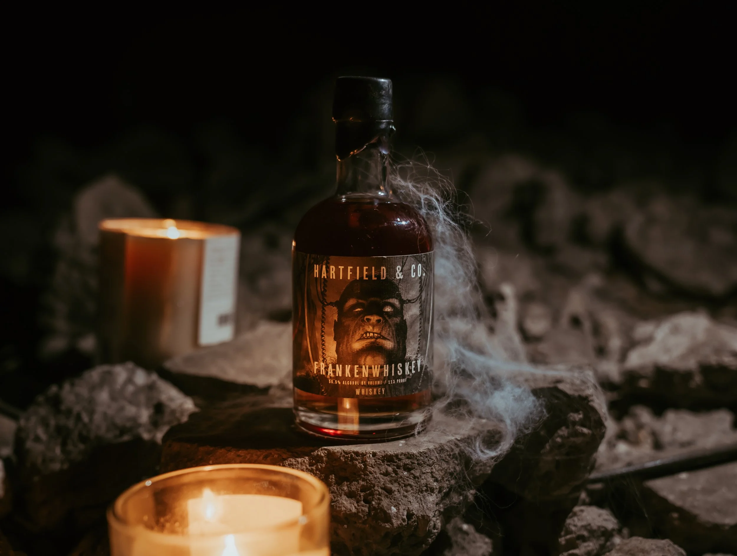 Frankenwhiskey Bottle sits in a spooky setting