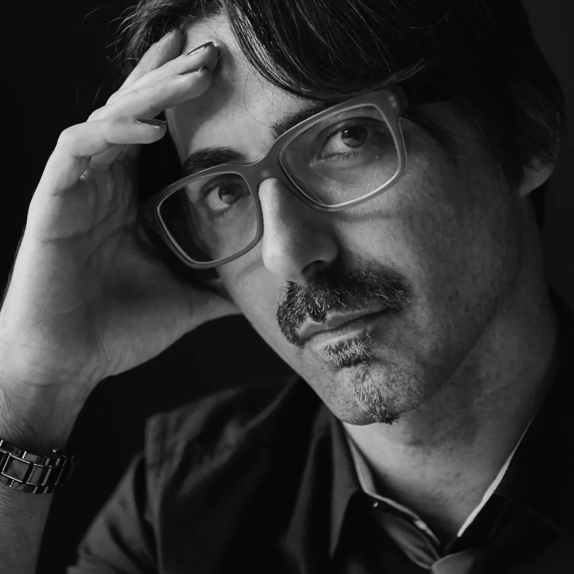 Sinclair 808 producer in studio with modular synths creating dark synthwave industrial music like Trent Reznor and Carpenter Brut.