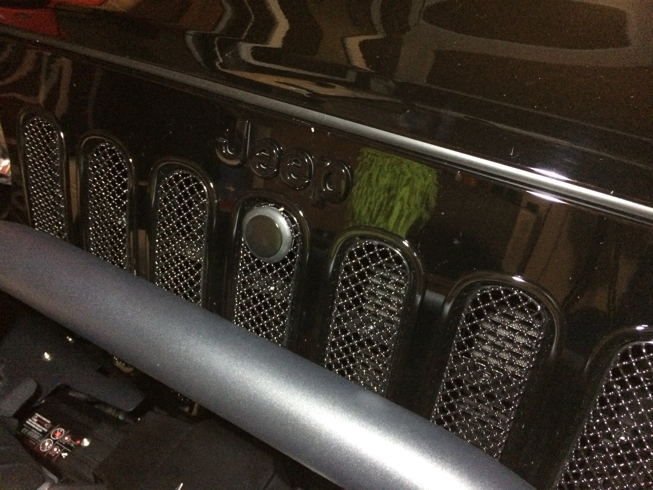 Grill mesh inserts with custom keyhole plug for unlocking the BOLT hood lock.