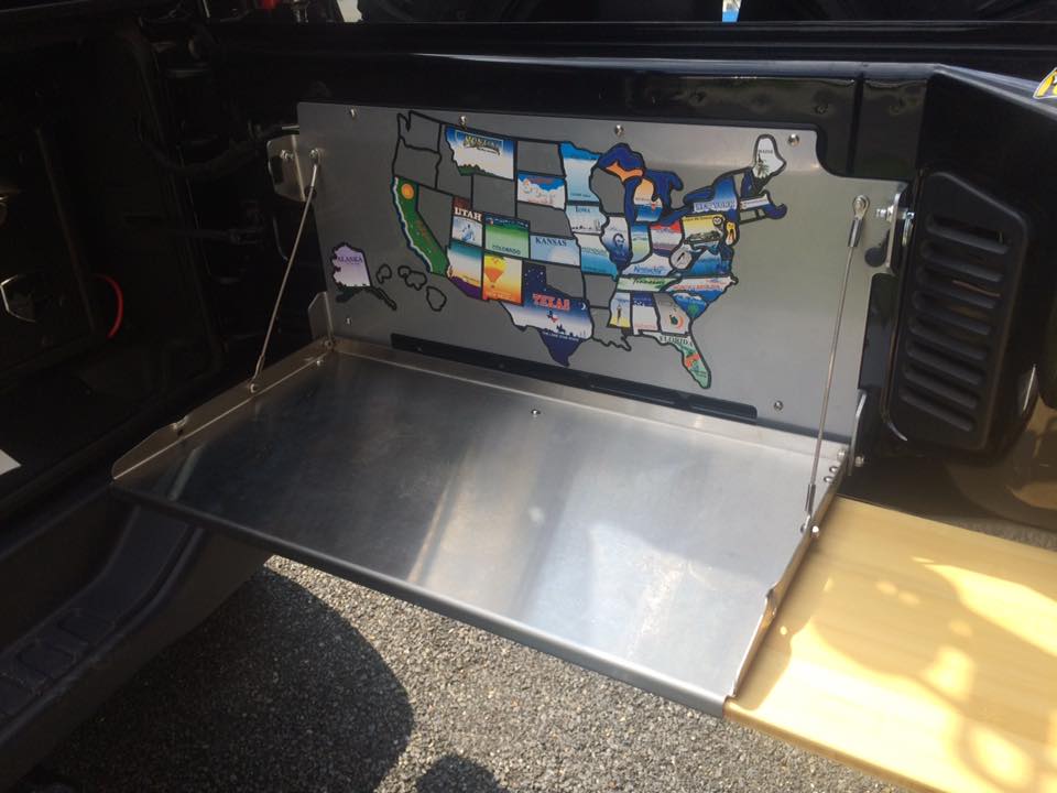 Rebel Off Road tailgate table with bamboo cutting board. States map applied.