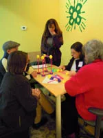 Group members attempt to construct an identical and connecting bridge section with the three other groups. 