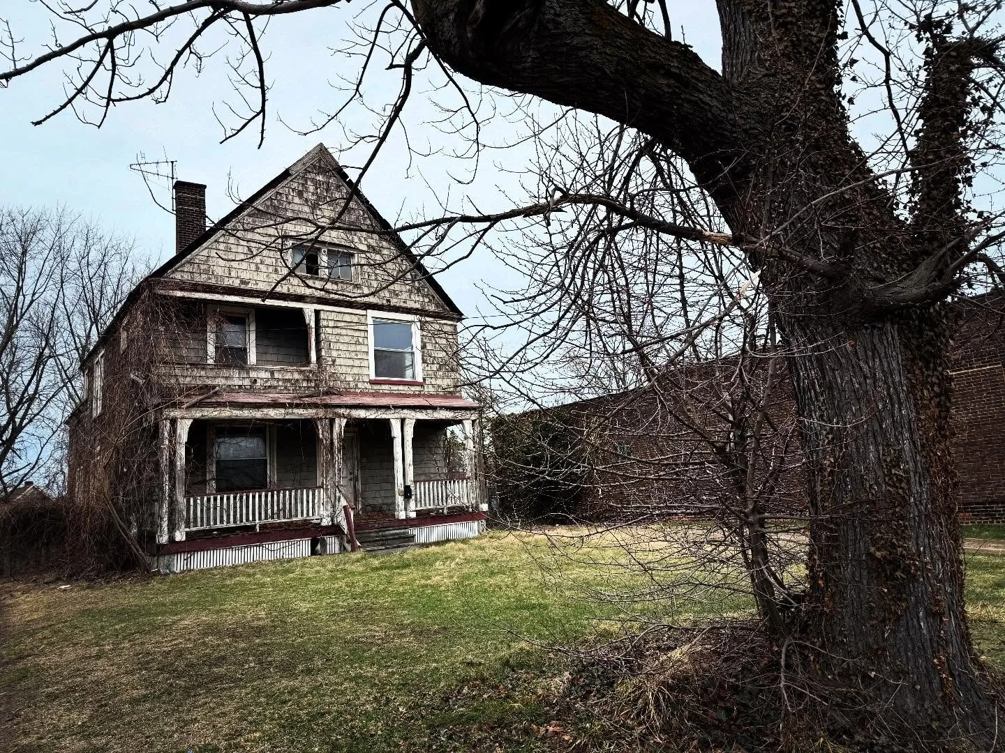 This house has sat empty in collinwood for as long as I can remember. There use to be a porcelain doll in the top window for years. Took this on a walk last week. The next day the wind storms ripped the tree out of the ground. 

&bull; &bull;
&bull; 