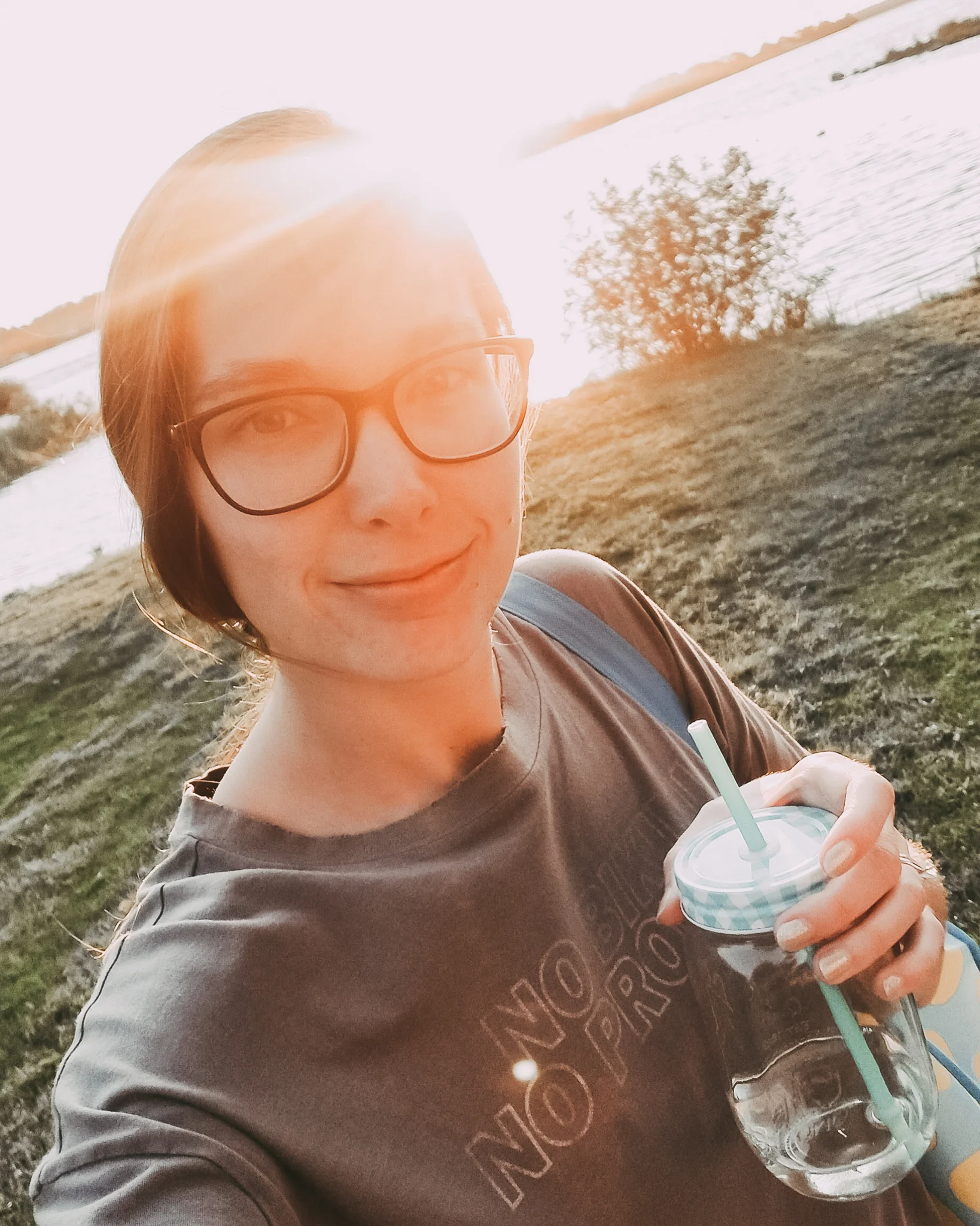 Me, happy, no makeup, unwashed hair, and a mason jar of wine.