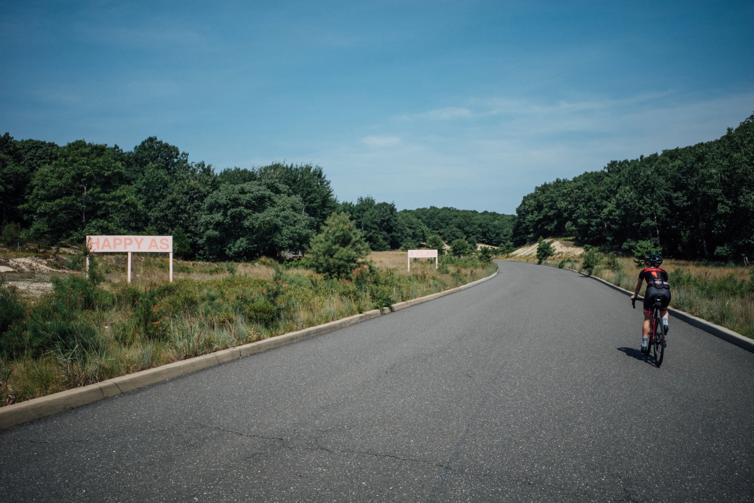 Blue skies and empty roads (on a golf course that costs $600,000 to join) = happy as a clam.