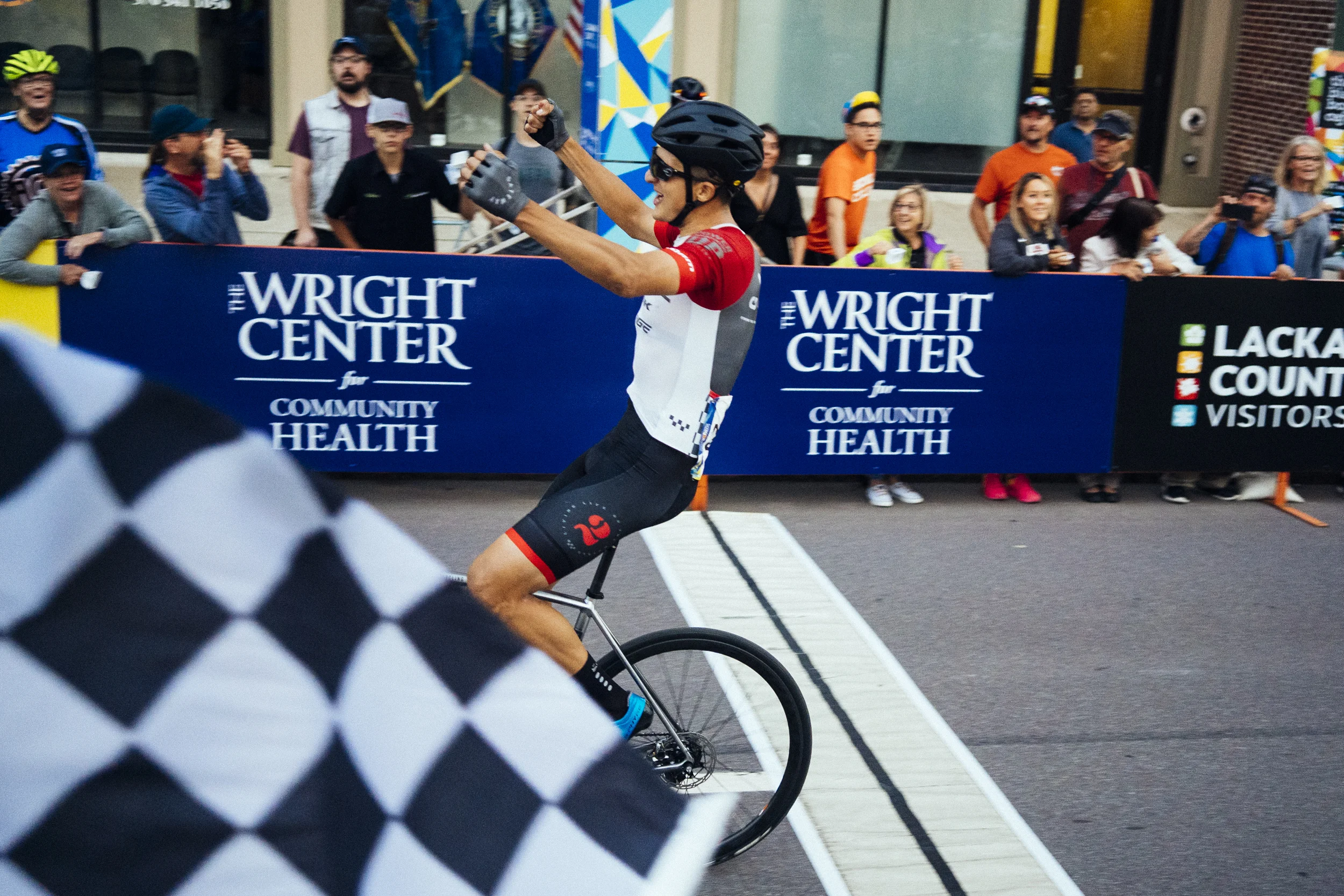 Bryan Gomez crosses the line on Wyoming Ave to take the Pro win