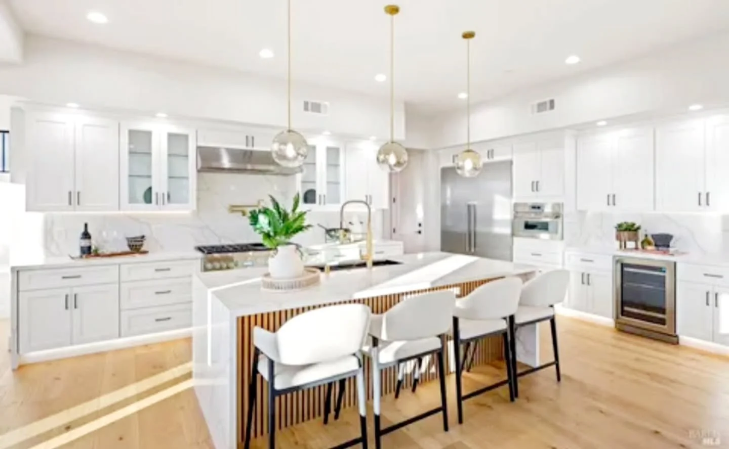 The kitchen is truly the gathering space in any home. This one is perfect for entertaining all of your family and friends.