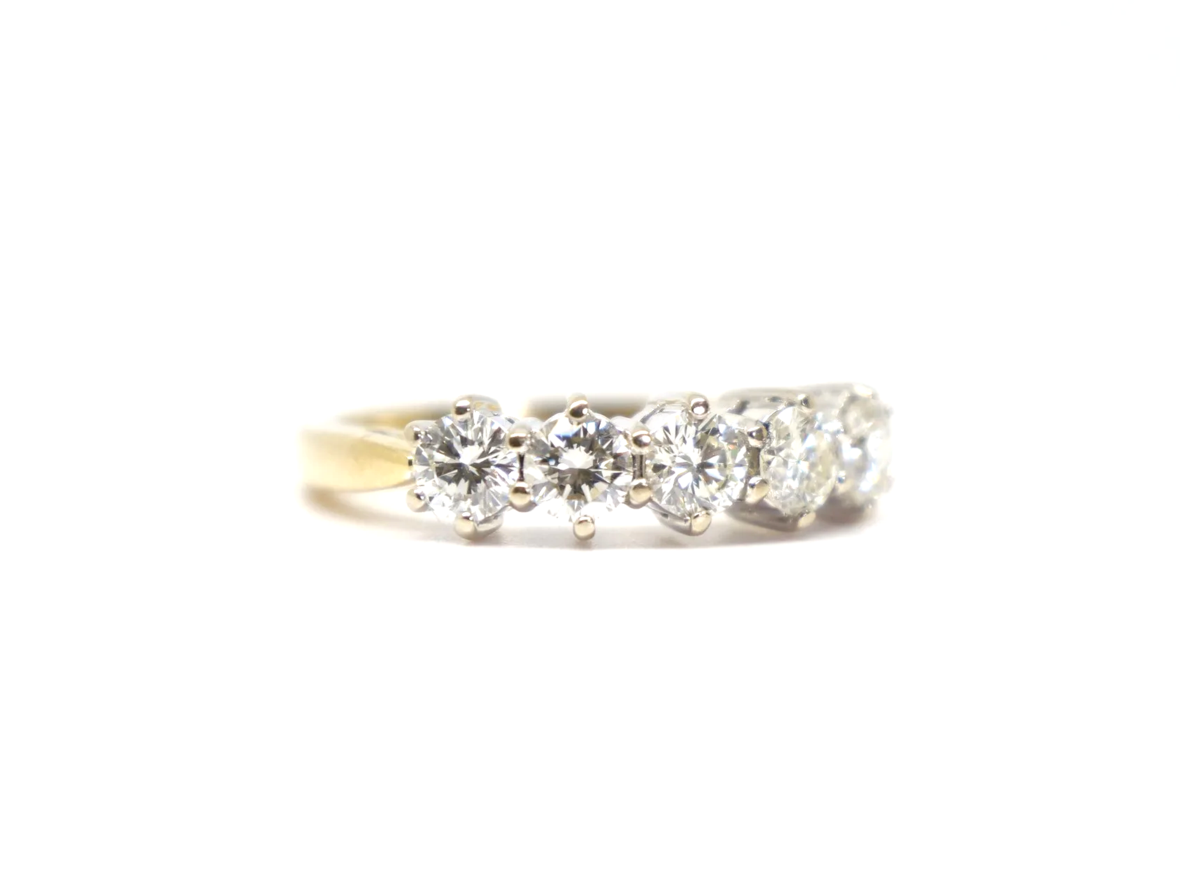 A classic five stone diamond ring in 18ct gold, set with five round brilliant cut diamonds of 1 carat in total.