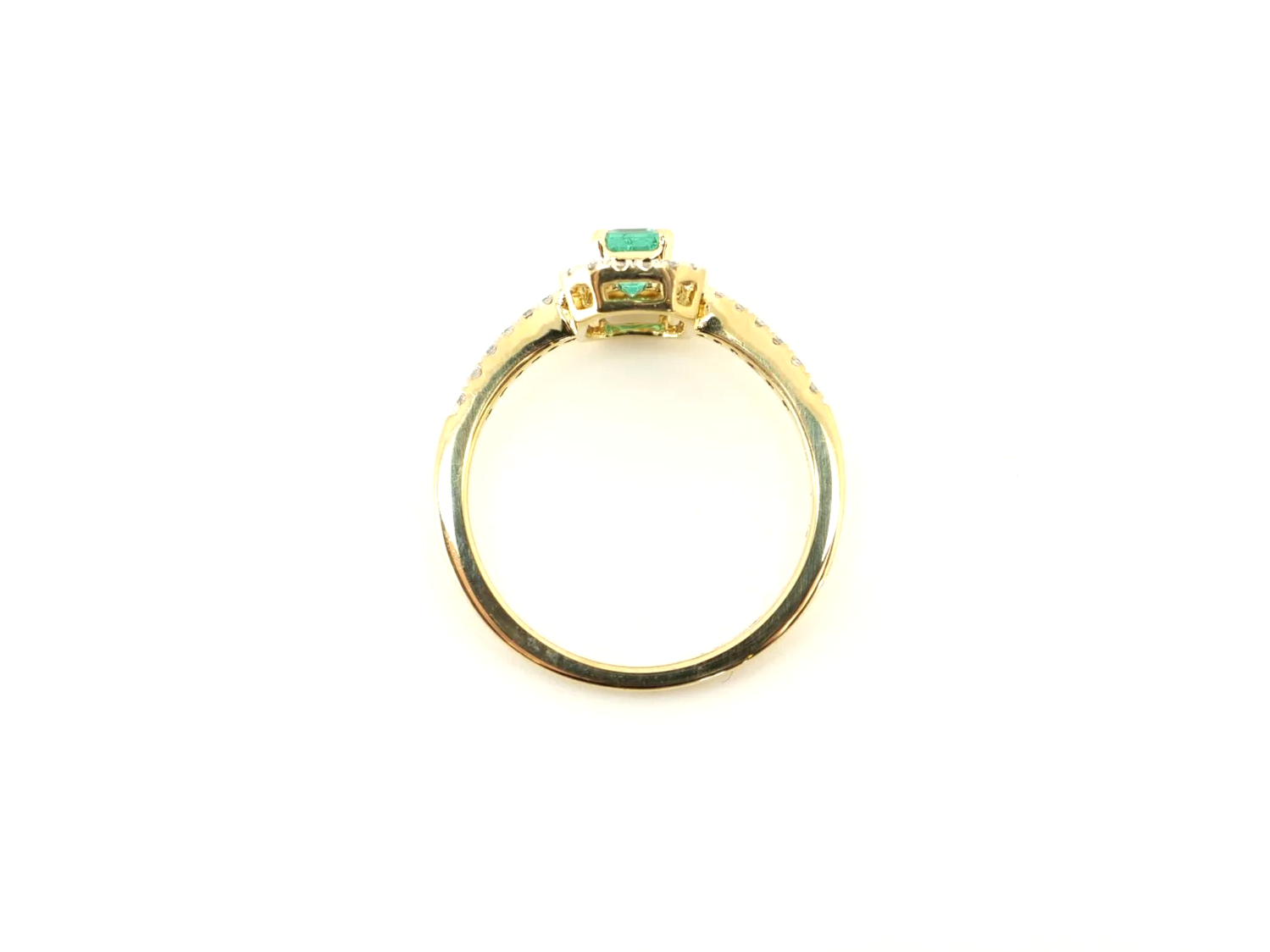 18ct gold emerald and diamond halo ring, emerald cut centre stone