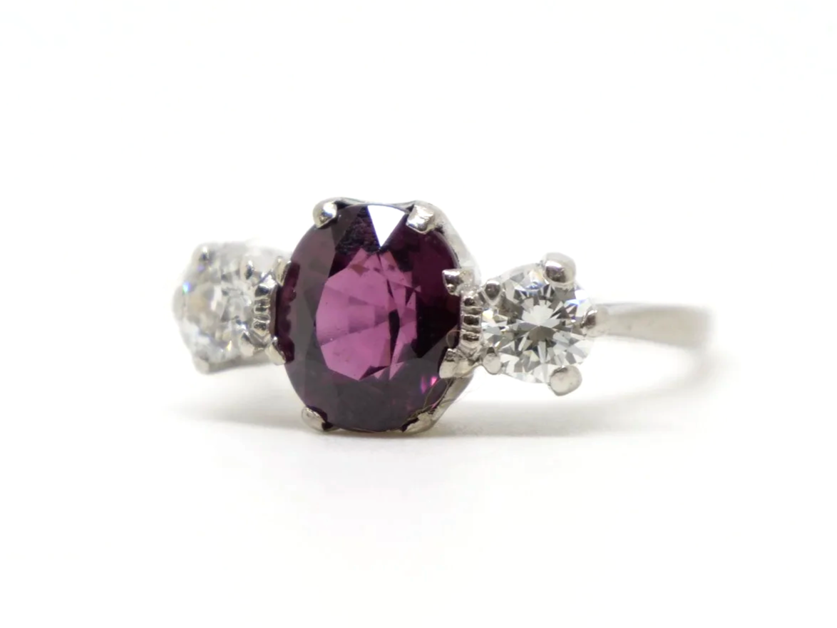 Gorgeous vintage 18ct gold & platinum pink tourmaline and diamond trilogy ring, set with a lovely oval cut pink tourmaline and set with a diamond to each side.