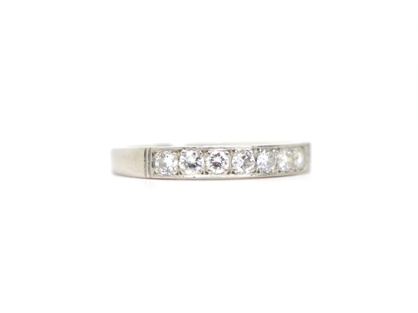 platinum diamond half-eternity ring set with seven round brilliant-cut diamonds