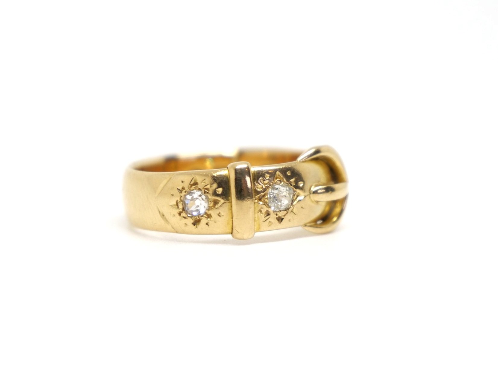 Super Edwardian 18ct gold diamond buckle ring in excellent condition. Set with two old cut diamonds and with a clear 1921 date stamp.