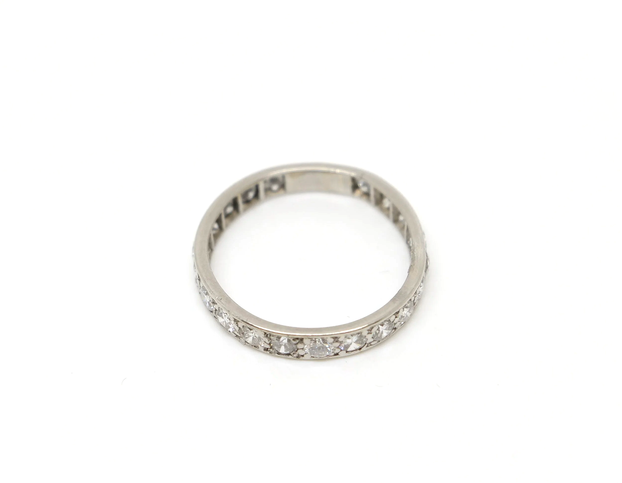 A vintage full eternity ring in 18ct white gold, set with round brilliant cut diamonds all the way around the band.