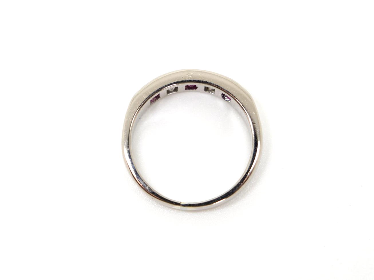 Bespoke 18ct gold ruby and diamond half eternity style ring, set with step cut rubies and princess cut diamonds.