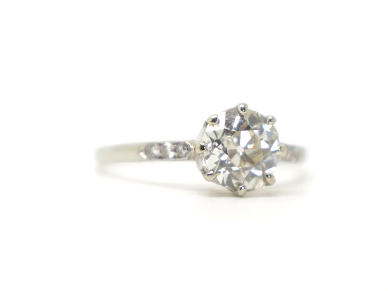 Stunning platinum Art Deco old cut diamond solitaire ring, set with a gorgeous, clear white old cut diamond, with further diamonds to each shoulder.