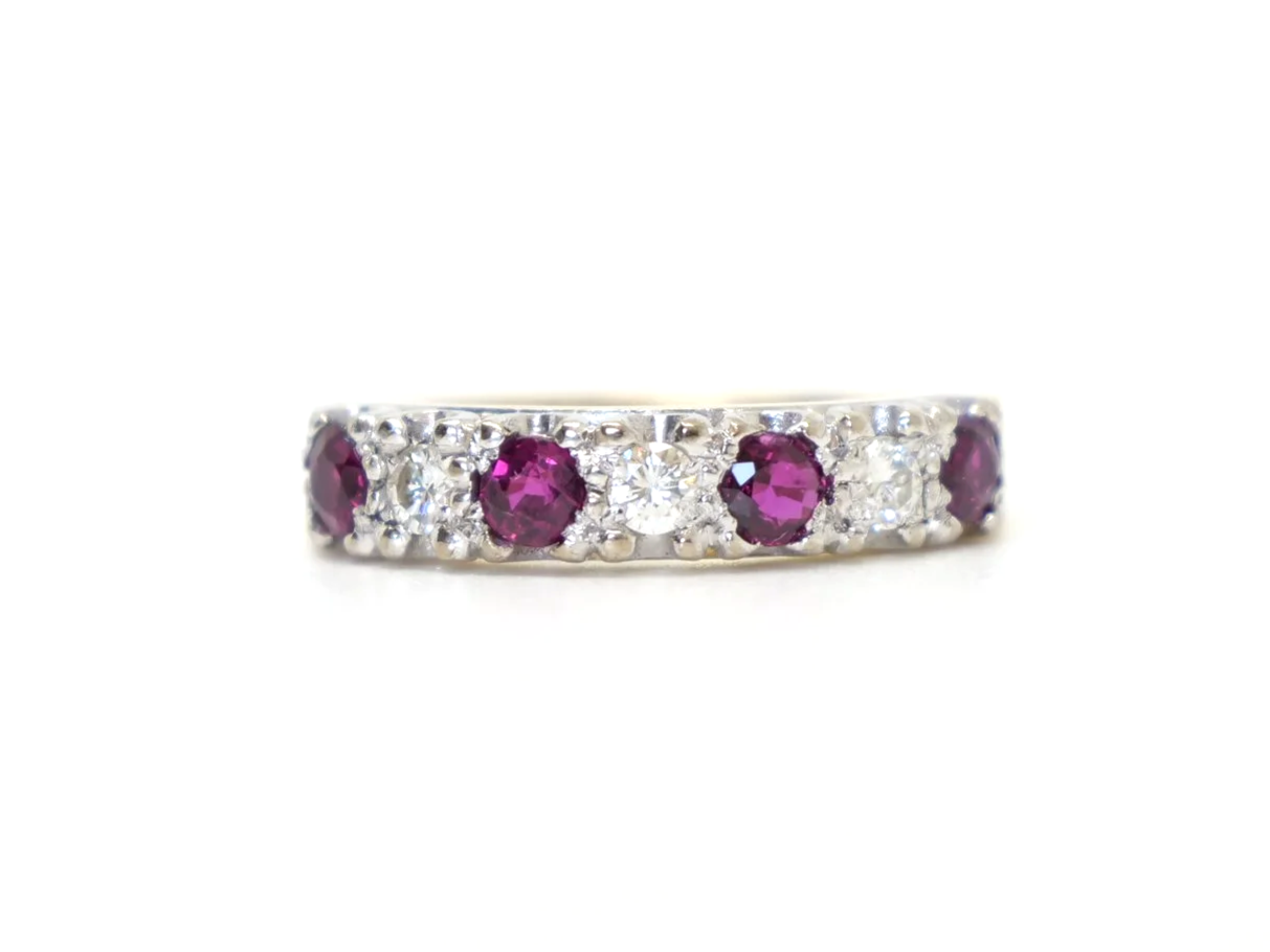 Lovely vintage 18ct gold ruby and diamond half eternity ring, set with three rubies and three diamonds. Unusual setting with a nice wide band.