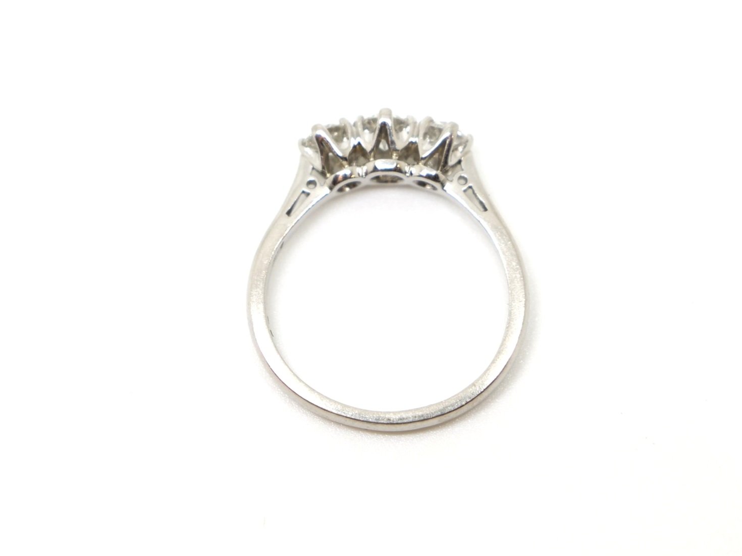 Super platinum diamond three stone ring, set with three brilliant cut diamonds graduating from centre stone. Approximately 0.86ct total diamonds.