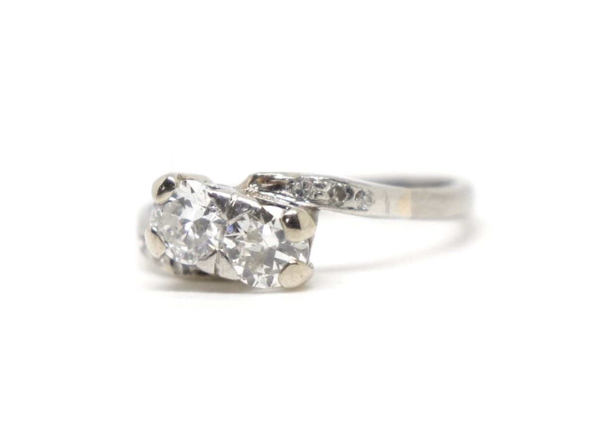 Art Deco diamond engagement ring, set in 18ct gold and set with two lovely old cut diamonds. Further diamonds to each shoulder.