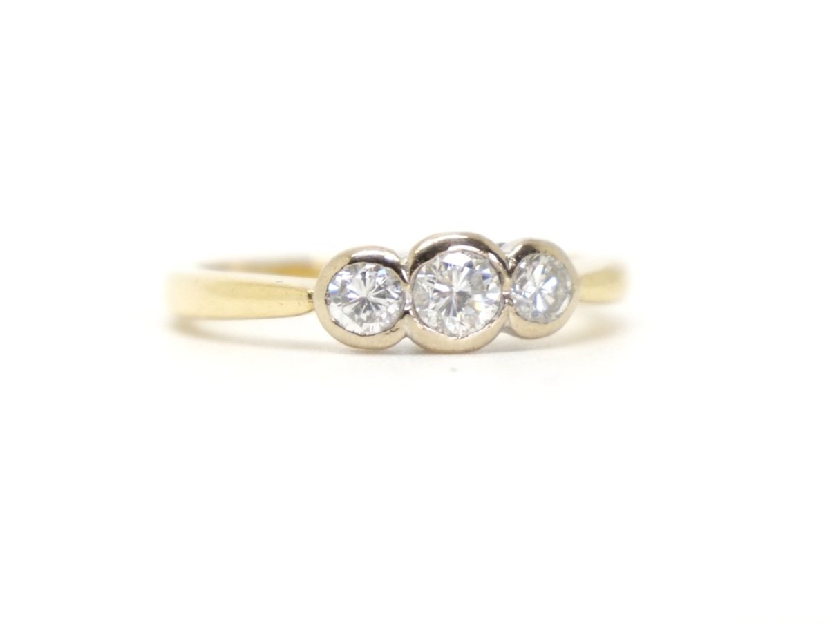Lovely 18ct gold diamond three stone ring, set with three brilliant cut diamonds in a rubover setting. Diamonds 0.5ct total.