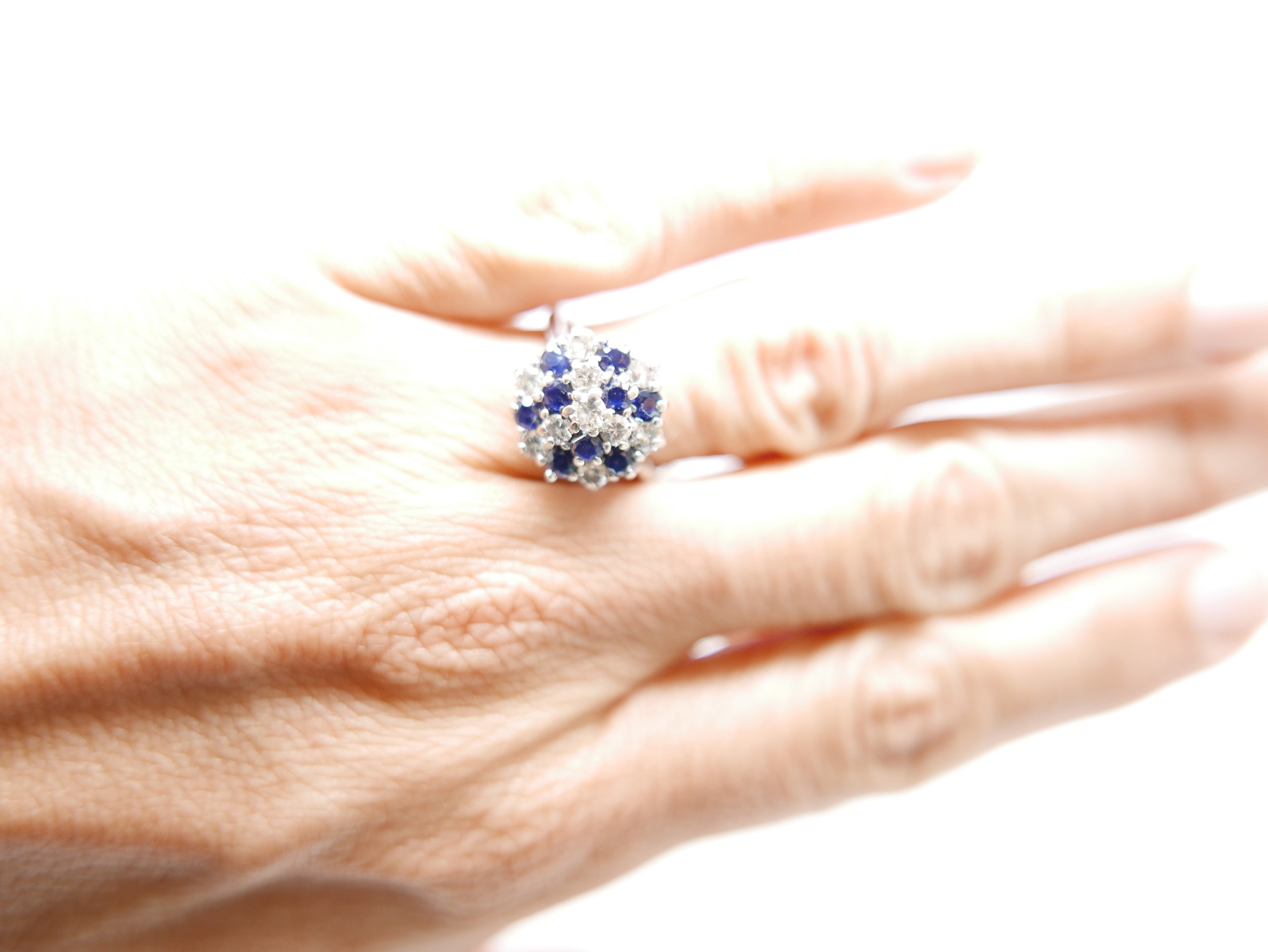 Vintage 18ct gold sapphire and diamond cluster ring, set with a mix of round cut sapphires and brilliant cut diamonds.