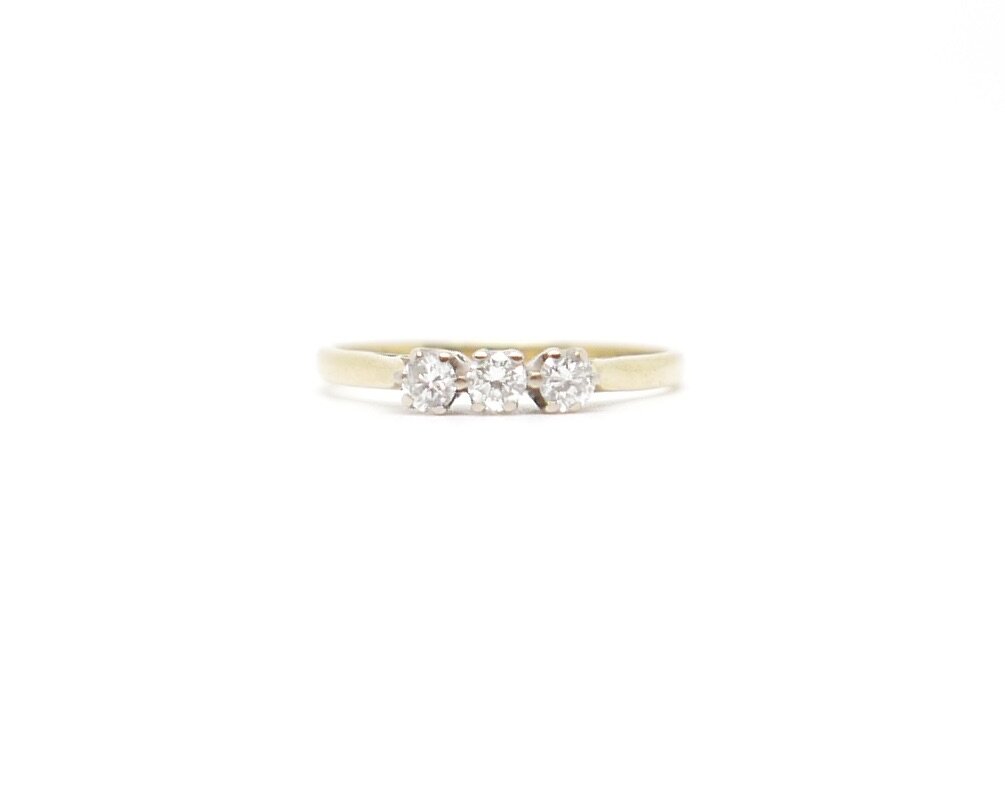 classic three stone diamond ring